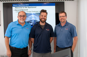 Each tour bus had a trainer and a driver. Rob Darrow (right), manager of strategic projects for Bosch, also joined Babcox for the event.