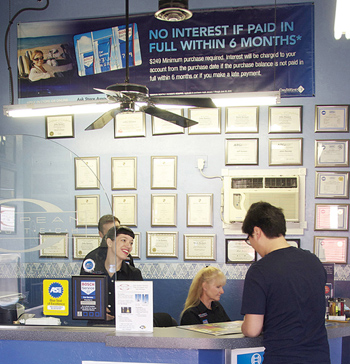 the bosch service credit card sign is strategically located above the front desk.