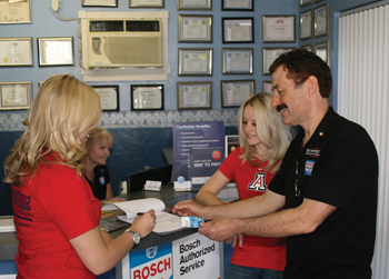 university of arizona students amanda berg (l) and devon gregory use the bosch service credit card.